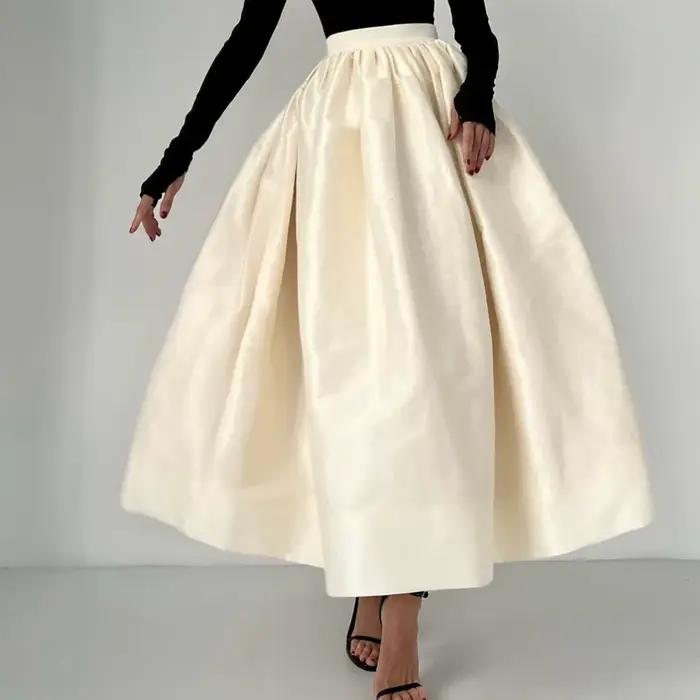 Jupe longue évasée taille haute, fine et polyvalente, au design original et tendance pour femme