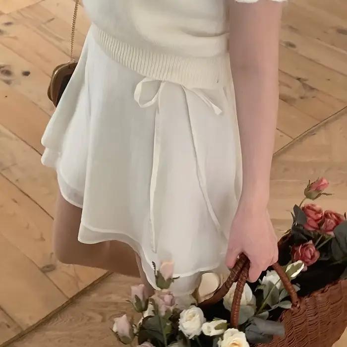 Nouvelle jupe courte en dentelle polyvalente pour filles, coupe trapèze, effet rajeunissant, été 202