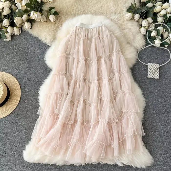 Jupe plissée en maille perlée pour femme, taille haute, couleur unie, à volants, décontractée, ligne