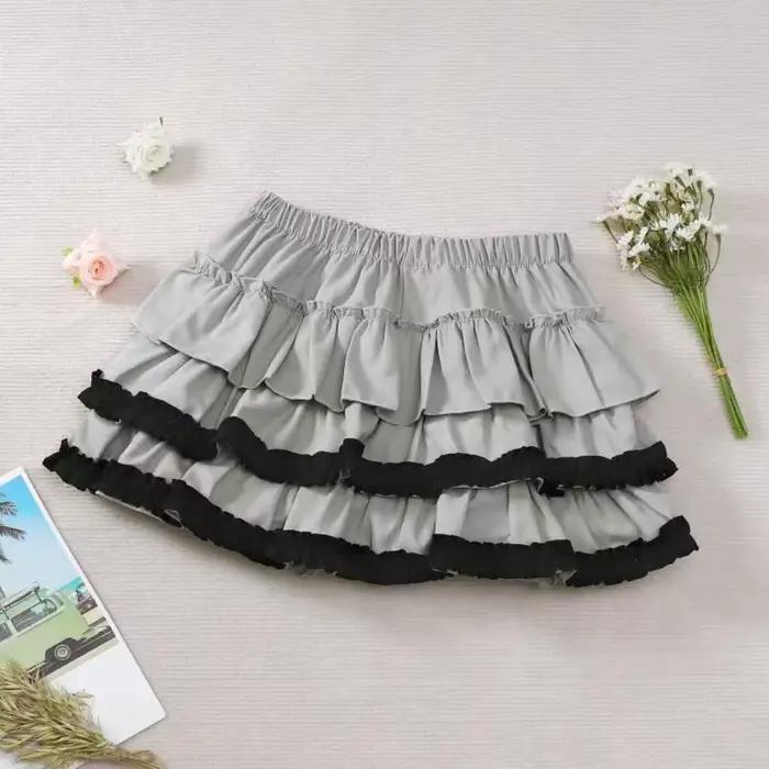 Mini-jupe Y2K imprimée noir et blanc pour femme, design ajusté, jupe plissée à volants superposés, t