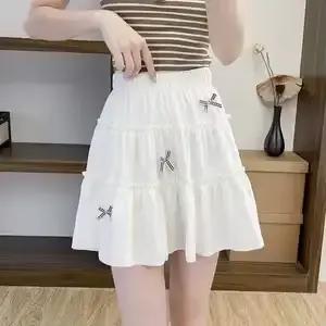 Jupe courte blanche à volants et nœud pour femmes, taille haute, coupe trapèze, pour petites filles