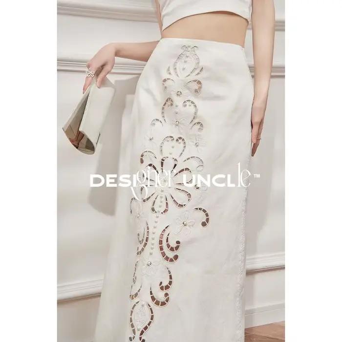 Nouvelle jupe longue d'été pour femme, broderie chinoise, design ajouré, couleur unie, élégante et h