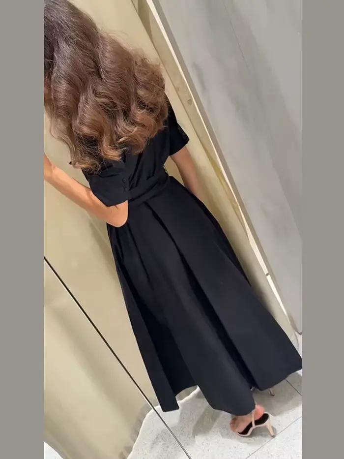 Robe longue élégante noire pour femme avec lacets, manches courtes, poches, ceinture et col rabattu – Collection été 2026 – Coupe ajustée