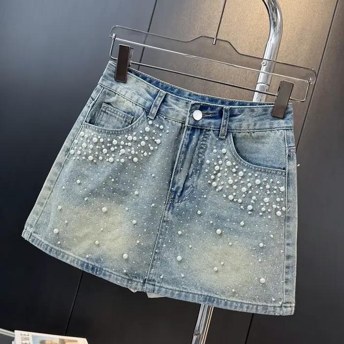 Mini-jupe en jean ornée de perles et strass pour femme