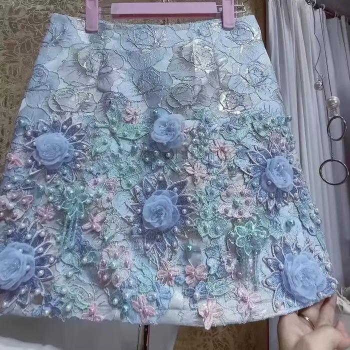 Design de luxe broderie fleurs 3D jupe courte perlée pour femmes pantalons courts jupes tendance mode Mini