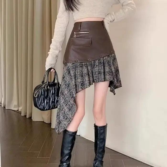 Jupe courte américaine en cuir Pu irrégulier pour femme
