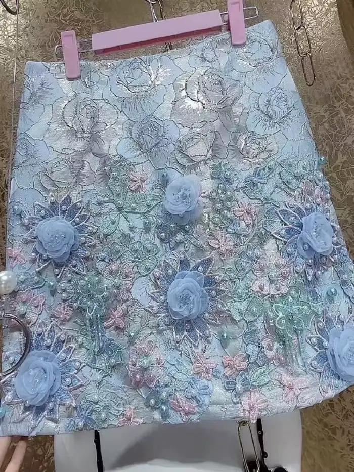 Design de luxe broderie fleurs 3D jupe courte perlée pour femmes pantalons courts jupes tendance mode Mini
