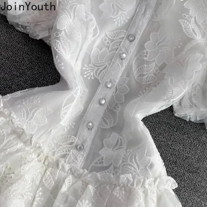 Robe d'été en dentelle blanche pour femmes, tunique de tempérament, manches bouffantes, broderie, à la mode, 2025