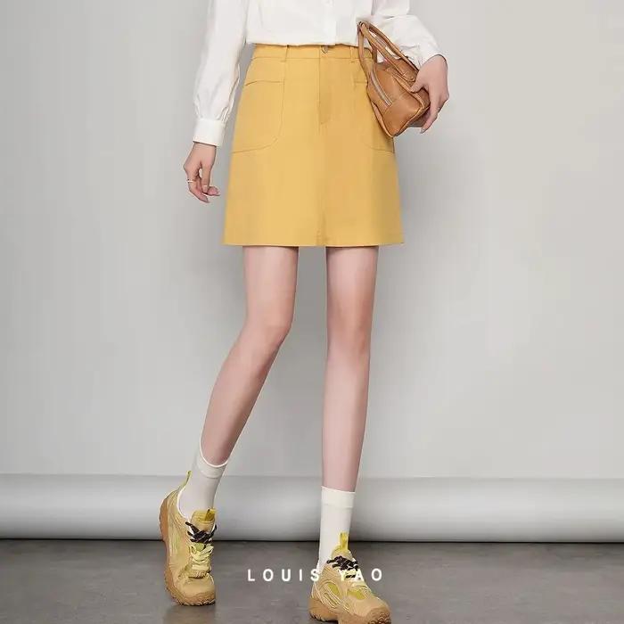 LOUIS YAO Jupes pour femmes Printemps 2026 Mini-jupe courte taille haute décontractée style professionnel avec boucle métallique
