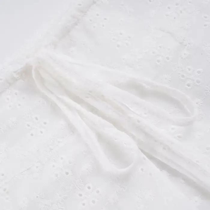 Jupe plissée jacquard taille basse avec cordon de serrage, jupe tissée blanche fine pour femme, collection été 2026