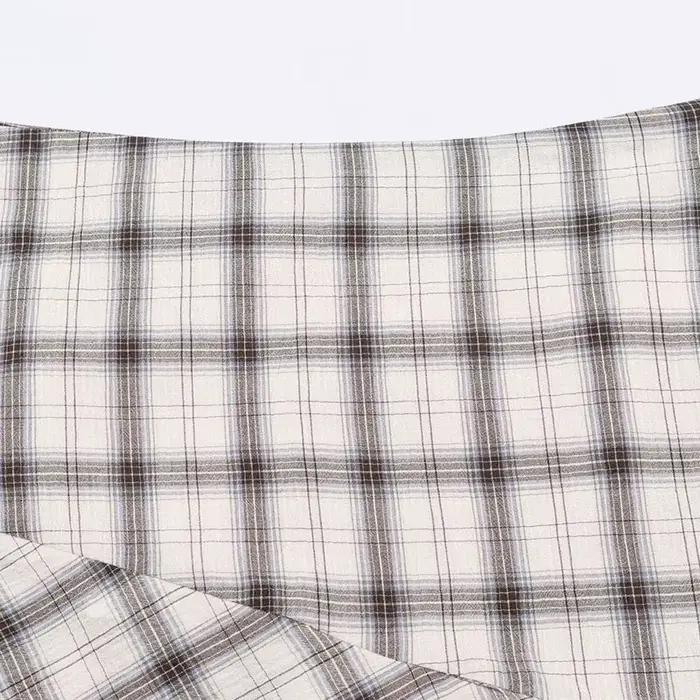 TFAFXY Nouvelle Collection Printemps 2026 Jupes Femme Chic et Élégantes à Carreaux Asymétriques Coupe Trapèze