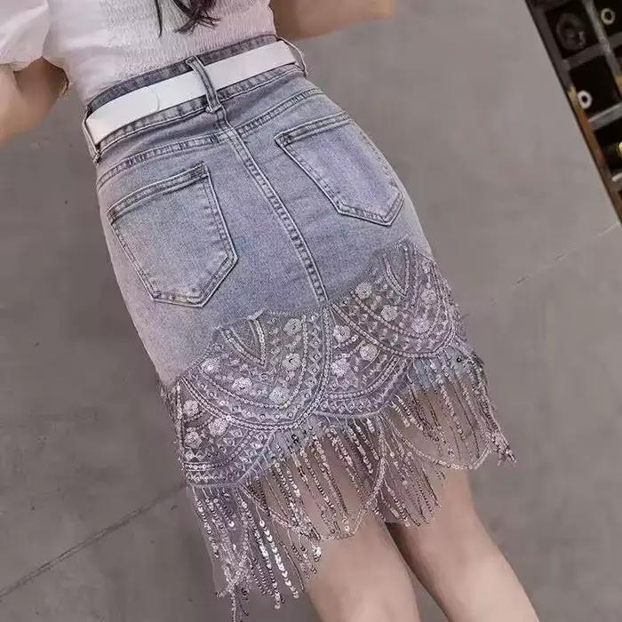 Paillettes glands jupe en jean 2025 été automne femmes paquet hanche bleu