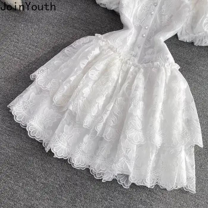 Robe d'été en dentelle blanche pour femmes, tunique de tempérament, manches bouffantes, broderie, à la mode, 2025