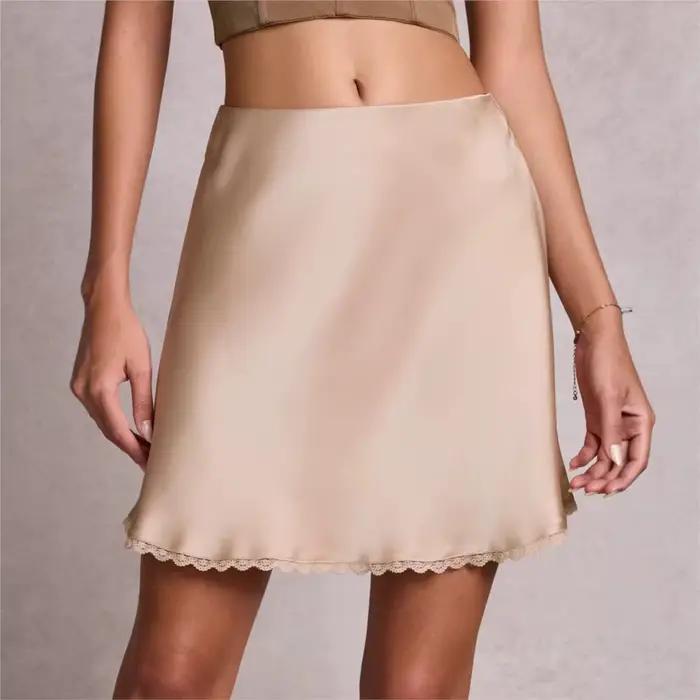 Nouvelle jupe courte évasée en dentelle sexy et élastique à taille haute pour femmes