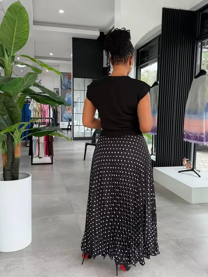 Jupe midi plissée élégante à pois unis pour femme