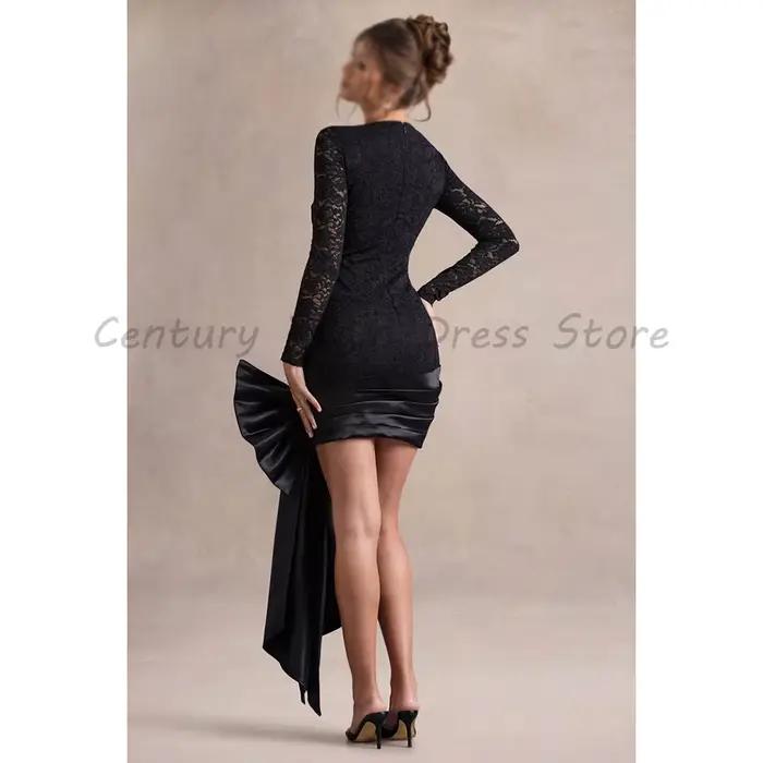 Robe de cocktail mini noire en dentelle, moulante, à manches longues et col rond, avec grand nœud en satin surdimensionné et traîne latérale, pour invitées de mariage et soirées