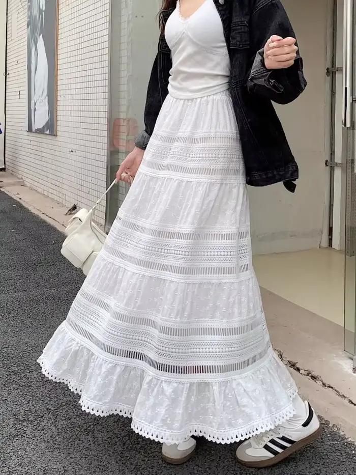 Jupe longue maxi brodée à œillets et découpes en coton blanc semi-transparente fluide pour femme