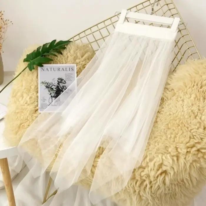 Jupe longue transparente en dentelle et tulle