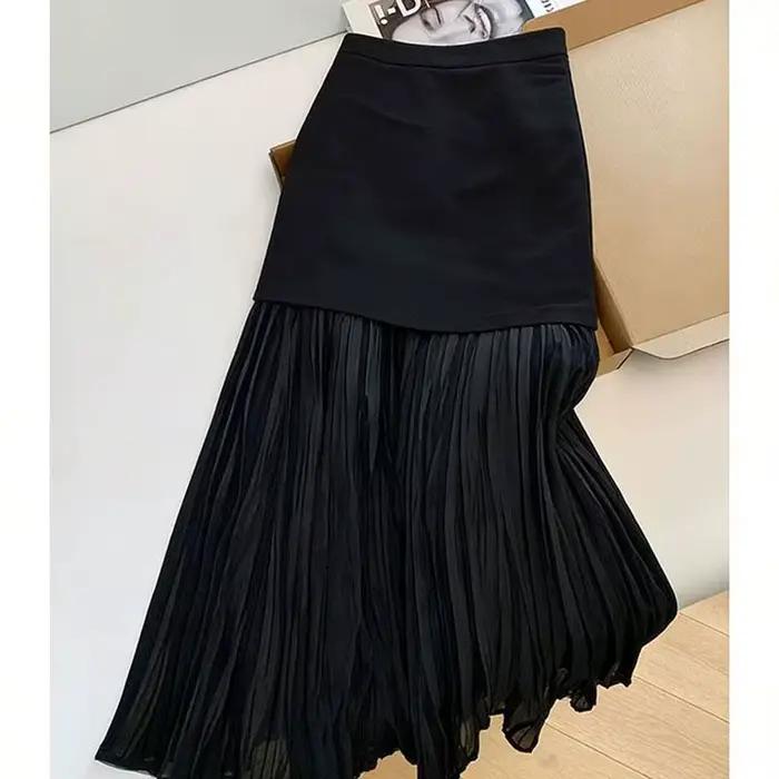 Jupe plissée noire à empiècements pour femme