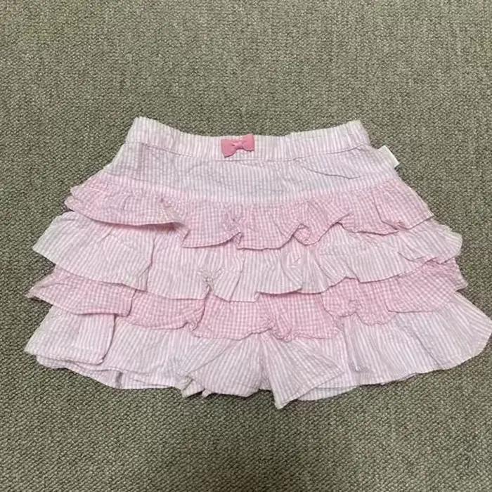 Europe léopard Sexy épices filles jupe décontracté Moda mince tout-match court Mujer Faldas champignon gâteau vente chaude Simple jupes à carreaux