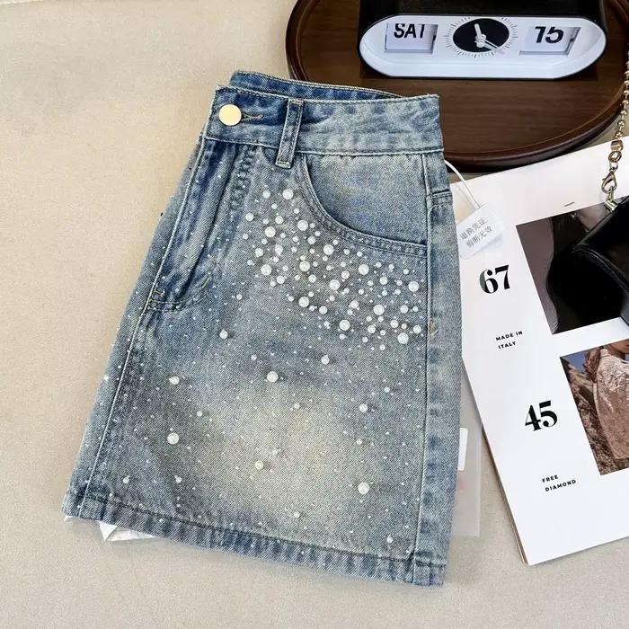 Mini-jupe en jean ornée de perles et strass pour femme