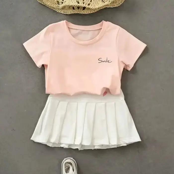 Jupe plissée pour filles, imprimé cœur, mignonne, douce, couleur unie, vêtements d'extérieur pour enfants, jupe courte Simple et décontractée avec pantalon de sécurité