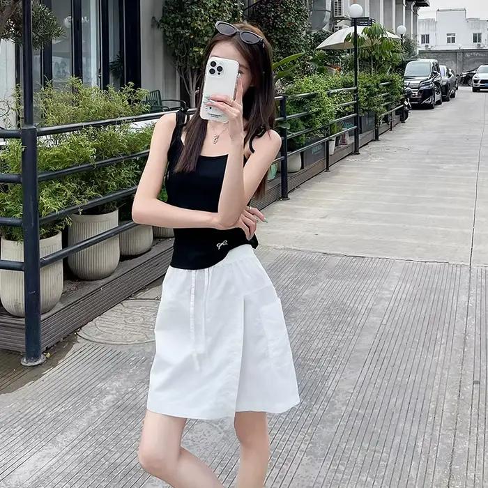 Faux 2 pièces Shorts jupes pour femmes taille haute Mini jupe blanche pantalon solide a-ligne fente latérale légère jupes d'été coréennes