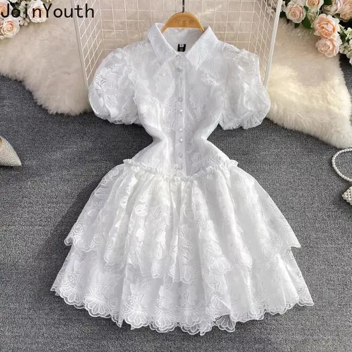 Robe d'été en dentelle blanche pour femmes, tunique de tempérament, manches bouffantes, broderie, à la mode, 2025