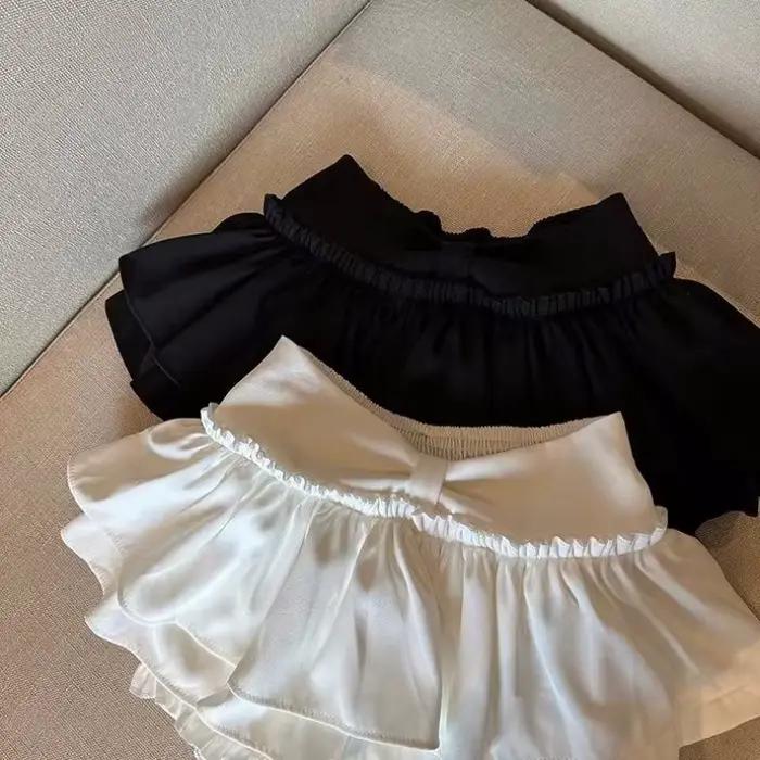 Jupe plissée bouffante Anti-culotte Flash Skort Ballet Academy Style Mini jupe évasée mignonne pour femmes Design superposé jeune