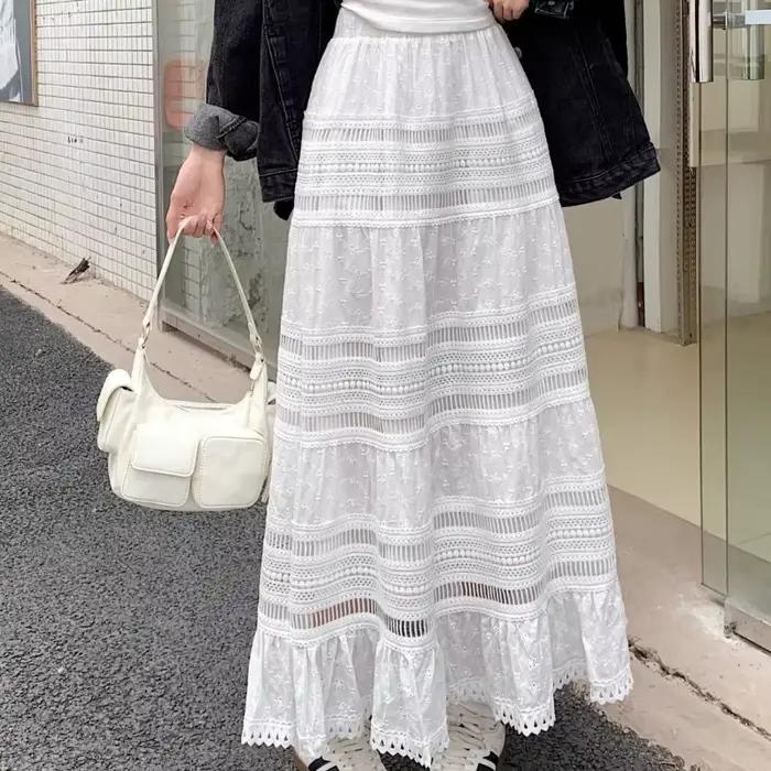 Jupe longue maxi brodée à œillets et découpes en coton blanc semi-transparente fluide pour femme