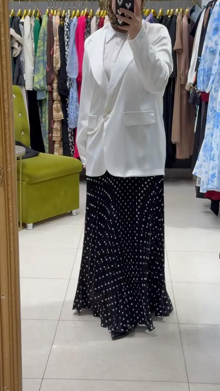 Jupe midi plissée élégante à pois unis pour femme