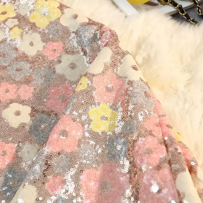 Jupe mi-longue à paillettes florales