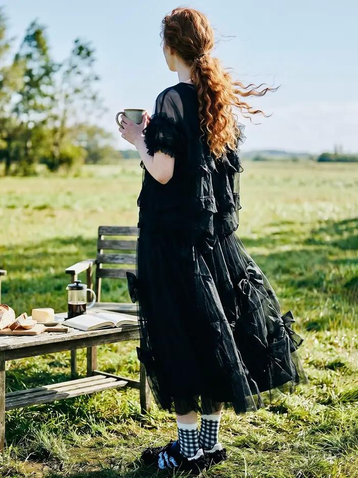 Jupe mi-longue à nœud noir pour femme