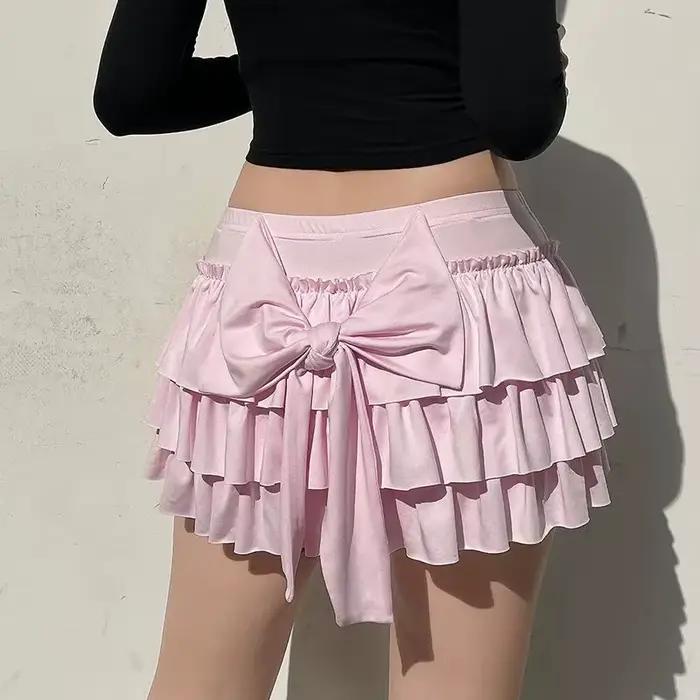 Mini jupes plissées à nœud rose pour femmes