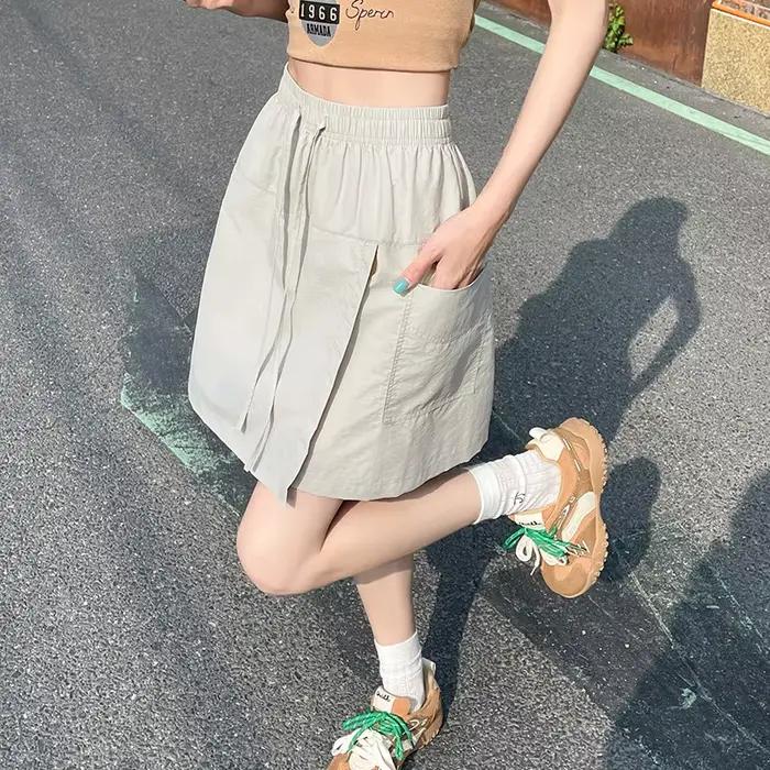 Faux 2 pièces Shorts jupes pour femmes taille haute Mini jupe blanche pantalon solide a-ligne fente latérale légère jupes d'été coréennes