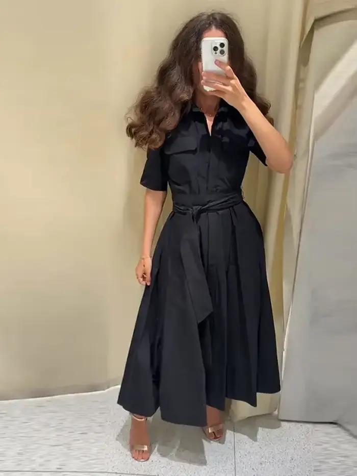 Robe longue élégante noire pour femme avec lacets, manches courtes, poches, ceinture et col rabattu – Collection été 2026 – Coupe ajustée