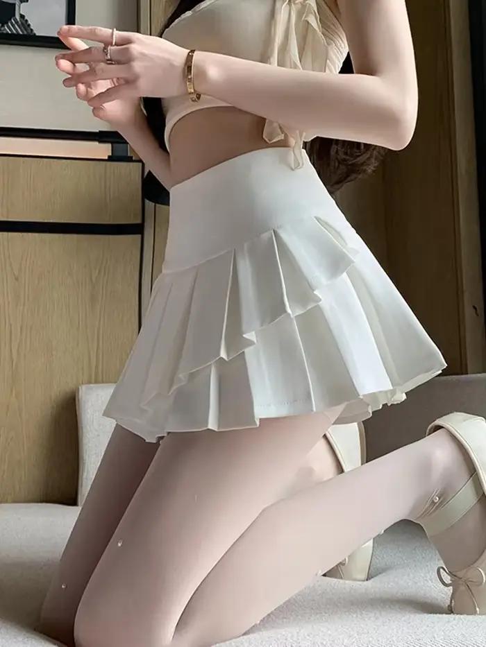 Style Preppy été jupe courte plissée irrégulière pour les femmes taille haute décontracté école douce Mini jupes avec volants