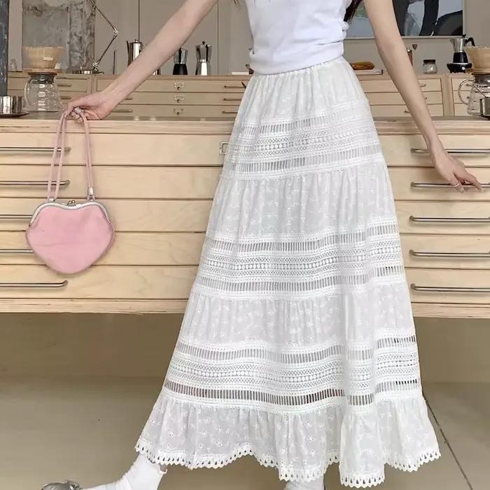 Jupe longue maxi brodée à œillets et découpes en coton blanc semi-transparente fluide pour femme