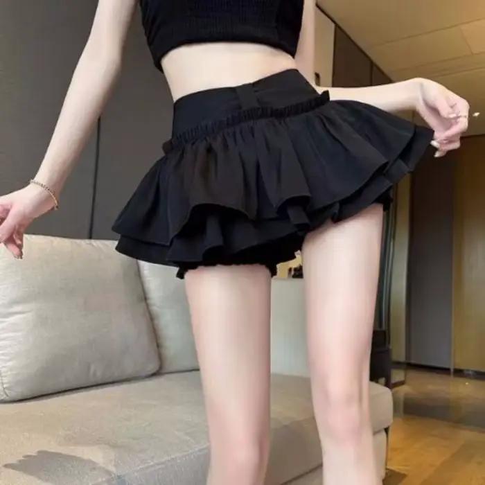 Jupe plissée bouffante Anti-culotte Flash Skort Ballet Academy Style Mini jupe évasée mignonne pour femmes Design superposé jeune