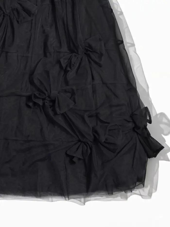 Jupe mi-longue à nœud noir pour femme