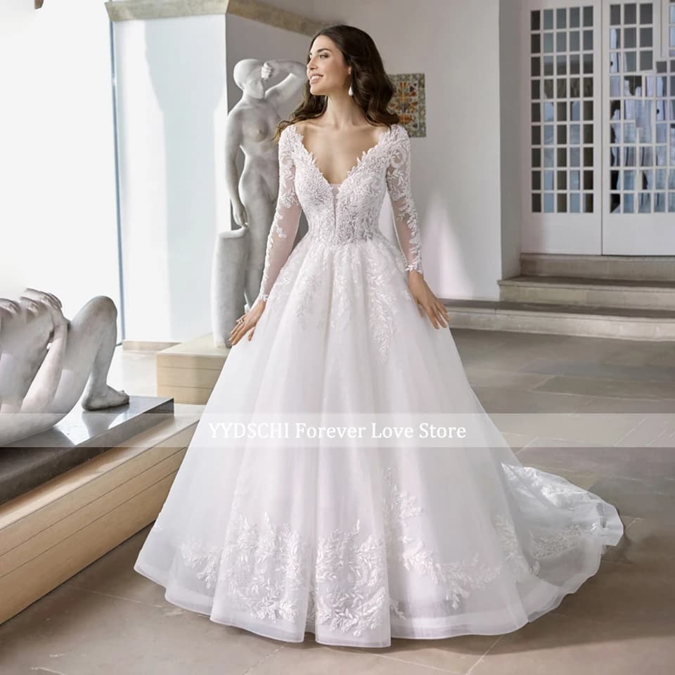 Robes de mariée élégantes blanches à manches longues coupe trapèze 2026, col en V profond, appliques