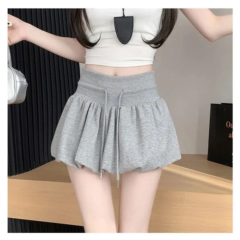 Jupe courte grise style ballet à cordon de serrage, coupe trapèze, taille élastique, effet amincissa