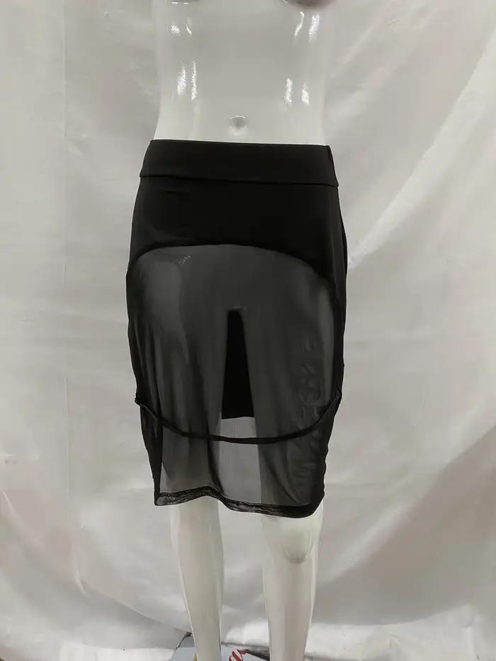 Nouvelle jupe moulante noire avec design sexy révélant les fesses pour l'été 2026, idéale pour la pl