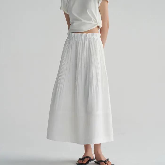 Jupe mi-longue plissée blanche, taille élastique, coupe ample, tissu doux, tenue quotidienne décontr