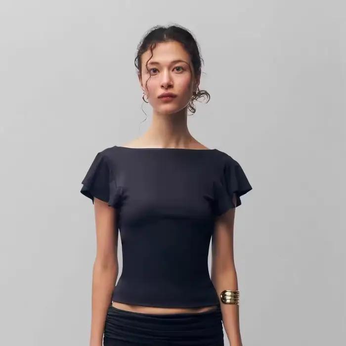 Jupe plissée noire à taille basse Guz, jupe irrégulière, haut à volants à une épaule et manches cour