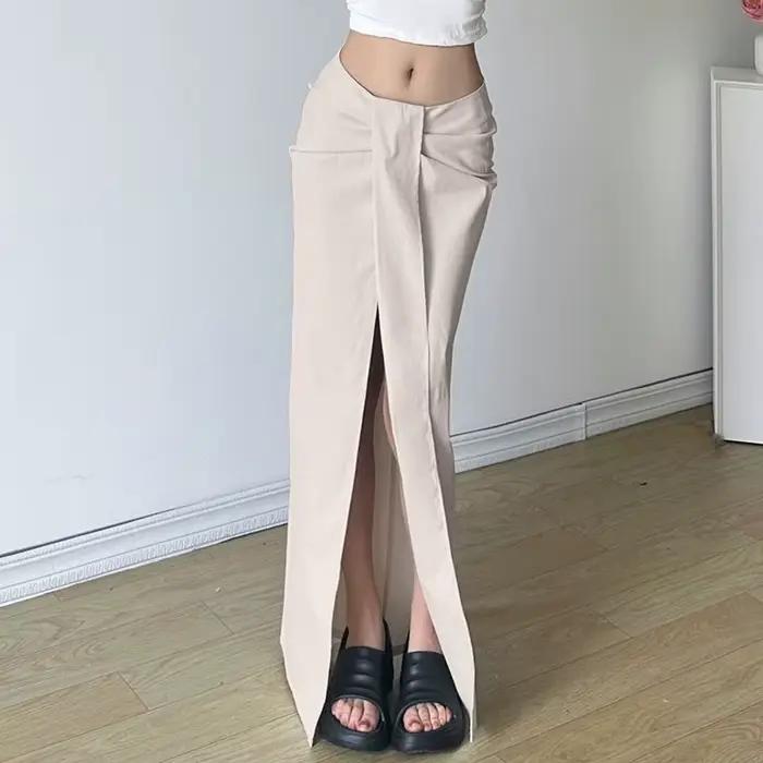 Jupe plissée au Design de rue européen et américain, taille basse, fentes irrégulières, couleur unie et robe longue
