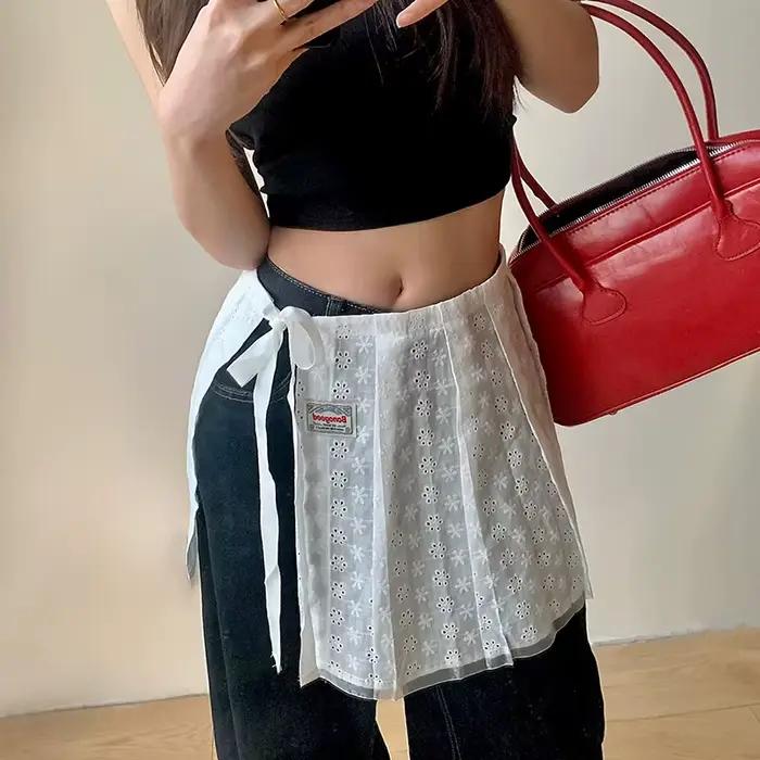 Jupe mi-longue ajourée en dentelle superposée avec ceinture