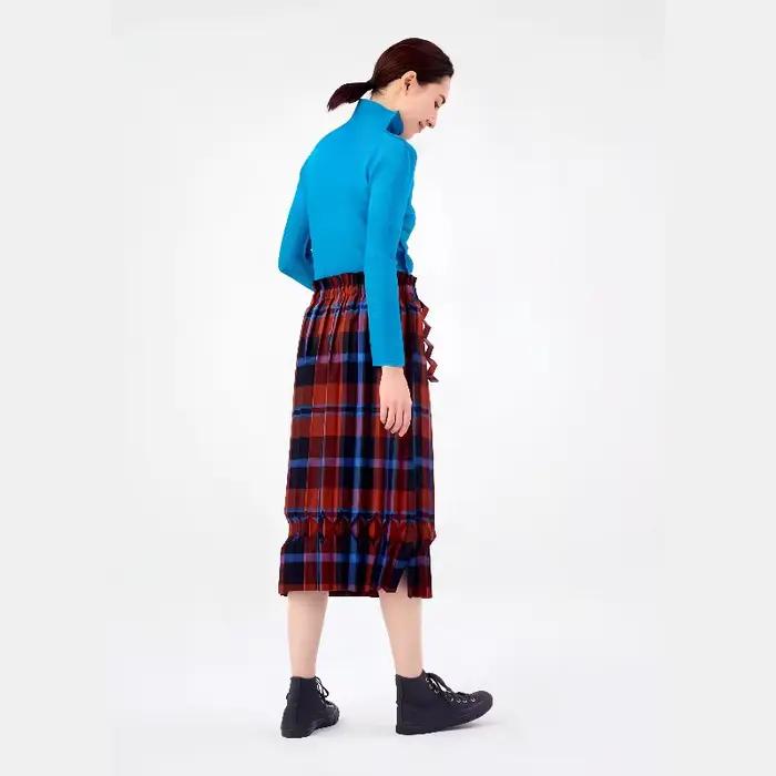Jupe plissée asymétrique à carreaux bleu et noir