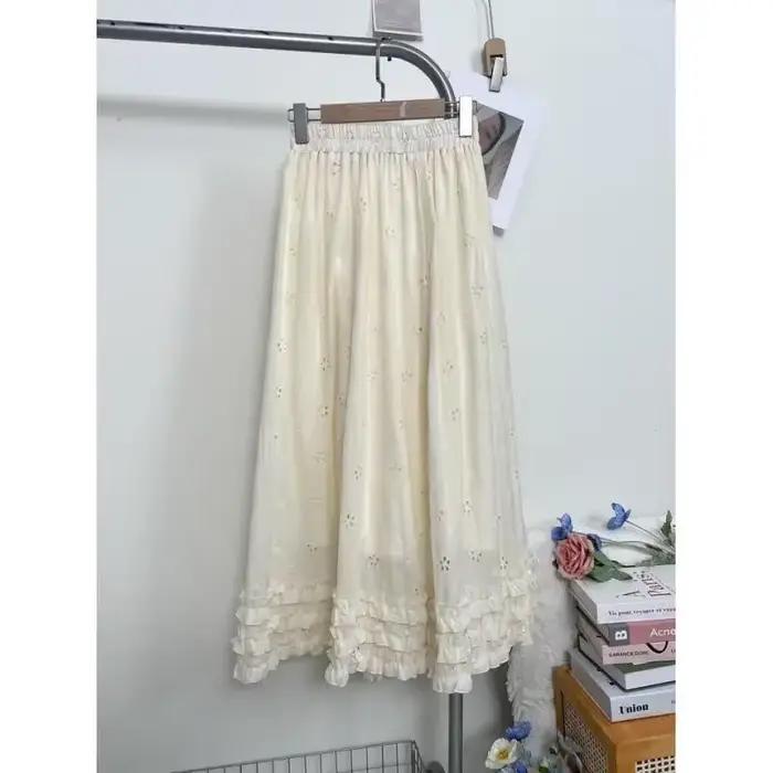 Jupe mi-longue brodée de fleurs creuses abricot français pour femmes, jupe mi-longue, Design tempérament, ligne a, printemps 2025