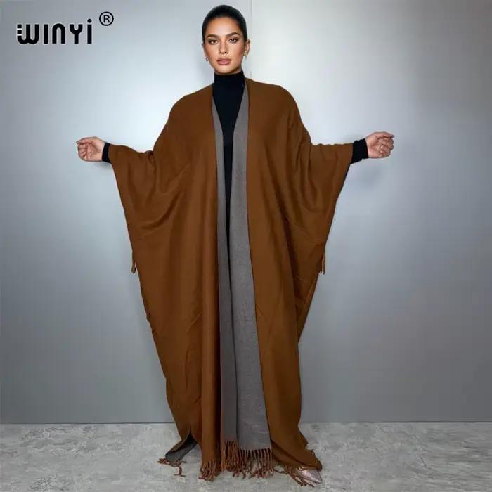 WINYI tenues d'hiver pour femmes de luxe fourrure glands manteau épais confortable chaud couleur unie mode manteau poncho longue robe en duvet